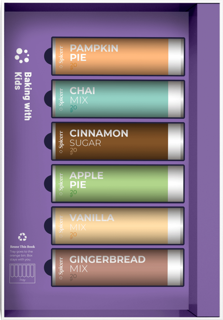 A collection of five spice mixes in colorful tubes: Pumpkin Pie, Chai, Cinnamon Sugar, Apple Pie, Vanilla, and Gingerbread, labeled "Baking with Kids."